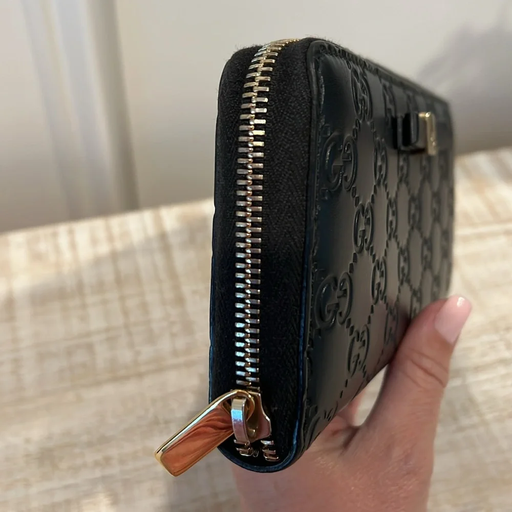 Gucci Black Embossed GG Leather Zip Wallet with Gold Tone Accent